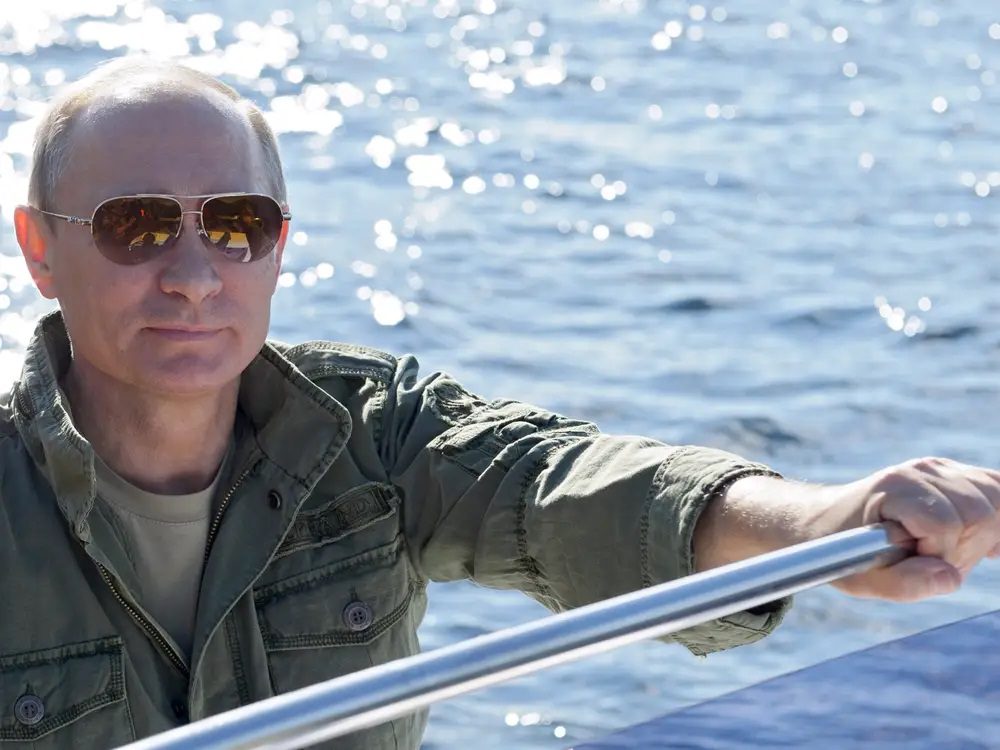 Vladimir Putin drives a yacht