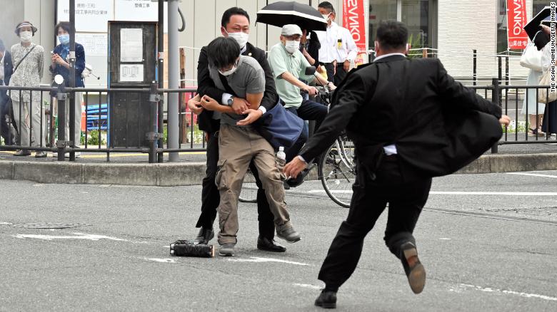 Security police arrest suspect who is believed to have shot former Prime Minister Shinzo Abe in front of Yamatosaidaiji Station on July 8, 2022 in Nara, Japan. 