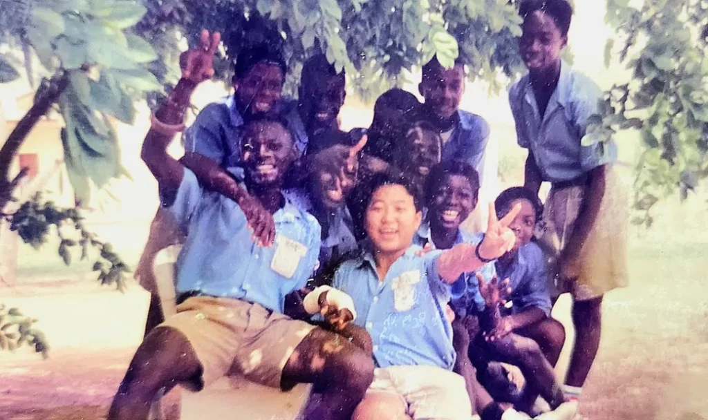 Kojo Choi picture with classmates in school in Ghana