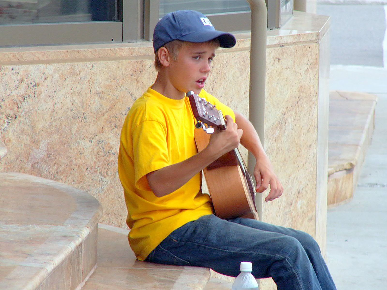 Young Justin Bieber on his guitar