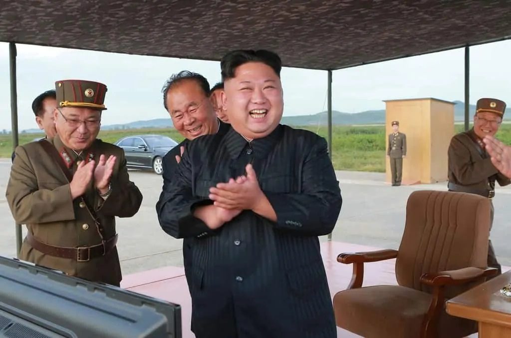 Kim Jon-Un laughs with generals
