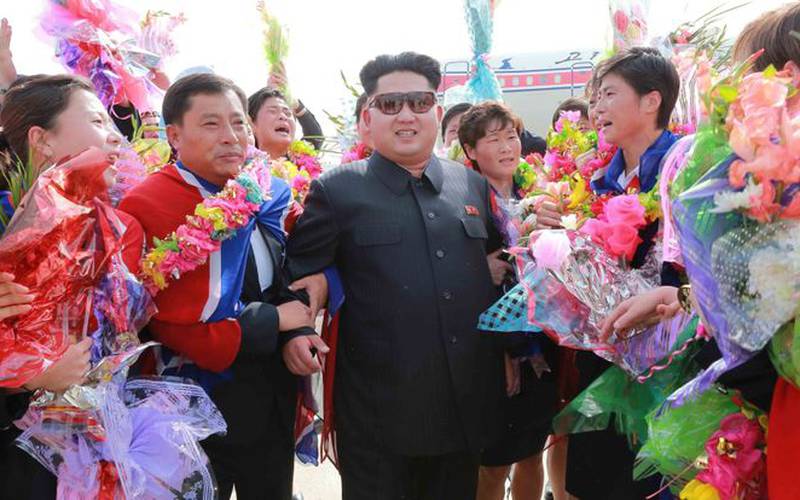 Kim Jon Un with jubilating Koreans